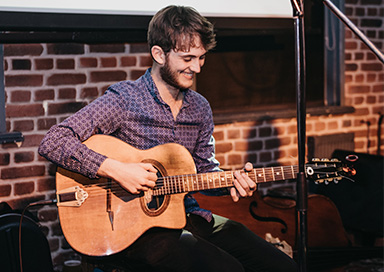 Acoustic Guitarist with Loop Pedal